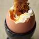 Illustration for article titled Point/Counterpoint: Bacon is Totally Overrated and Eggs Have an Image Problem